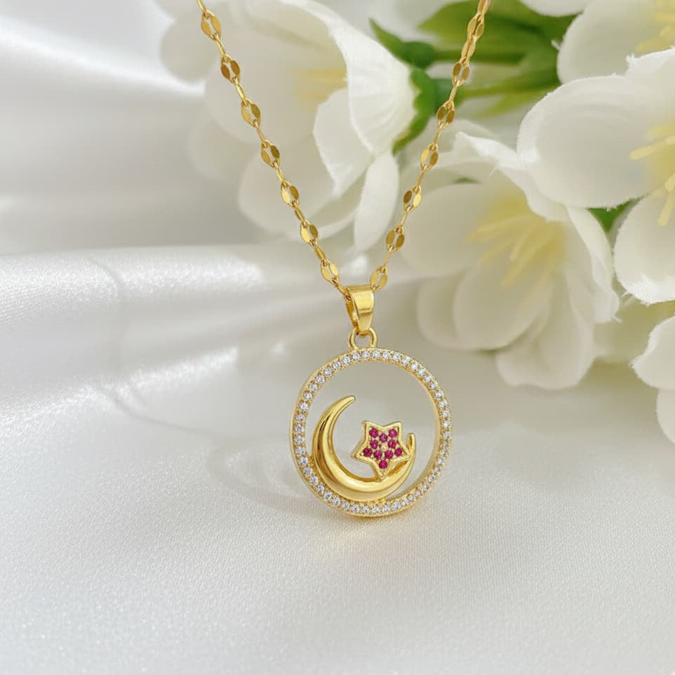 Gold necklace with a crescent moon and star pendant on a white floral background