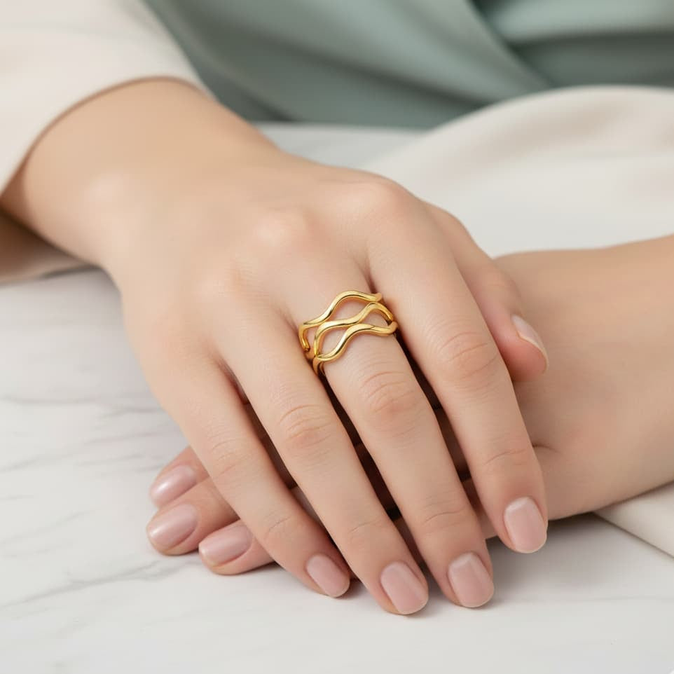 Gold ring on a hand with a soft focus background