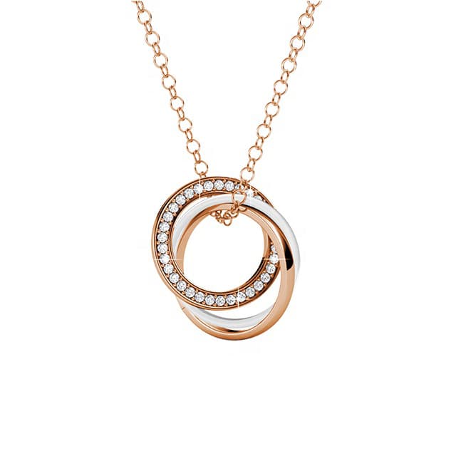 Rose gold and silver circular pendant necklace on a white background