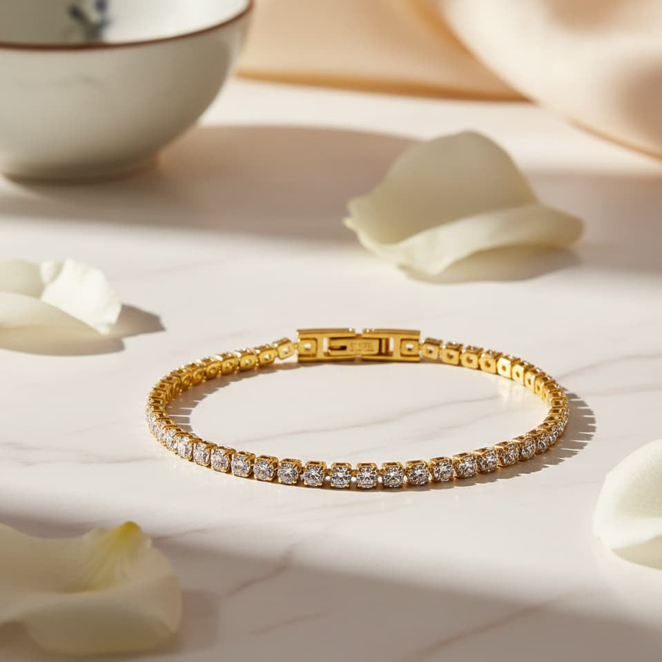 Gold bracelet with diamonds on a light surface with white petals